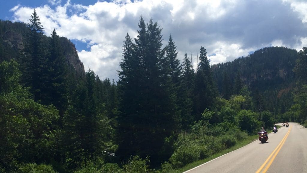 Motorcycles riding through Spearfish Canyon, Spearfish, South Dakota