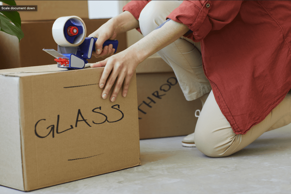 woman packing up glass