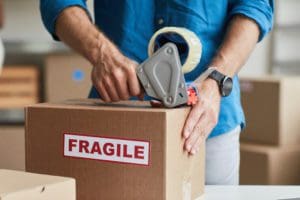 Man Packing Box Close Up